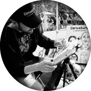 Steven Simon drawing caricatures at a Houston area festival